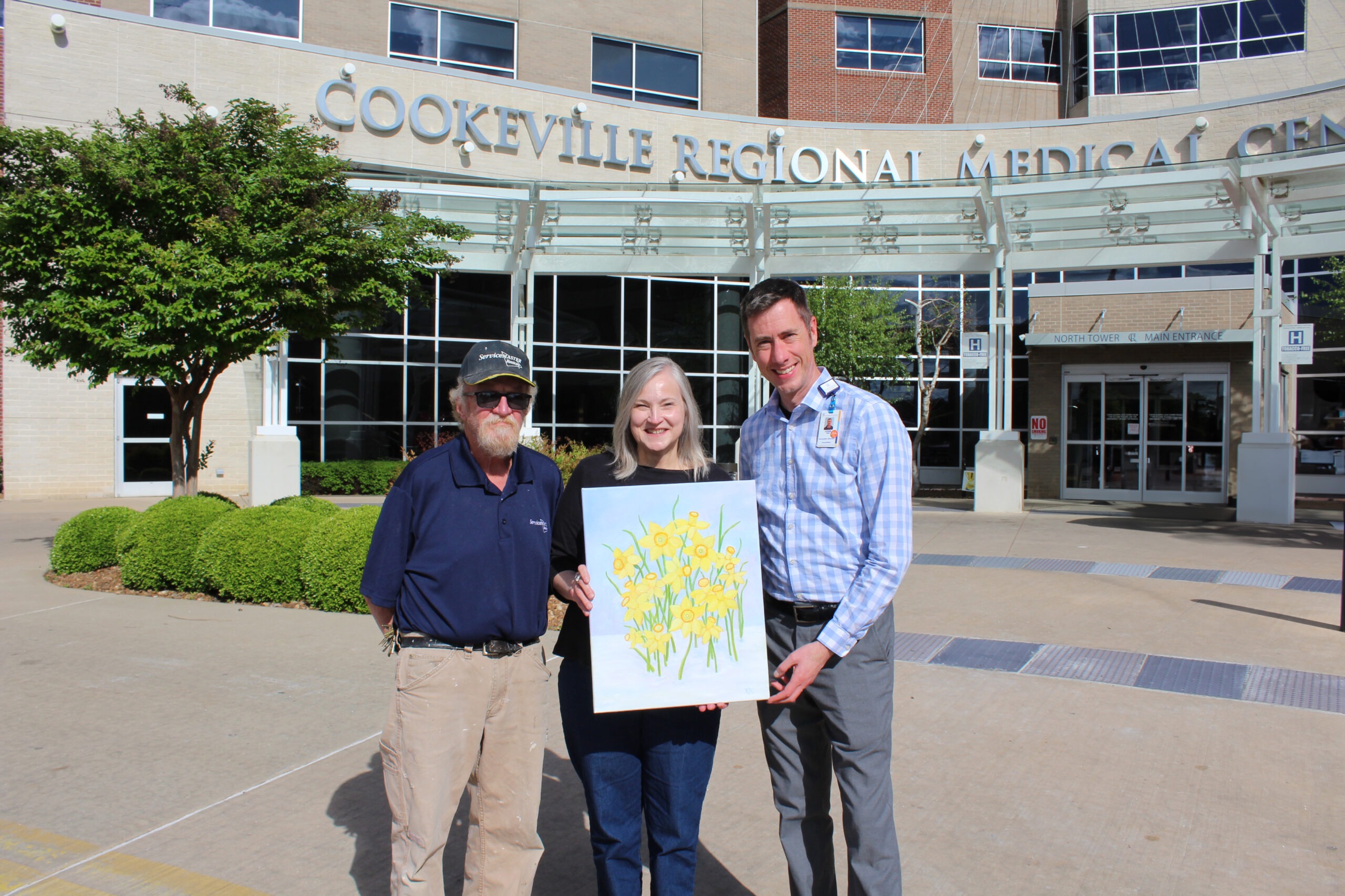 Kase family presents painting to CRMC Foundation Director John Bell