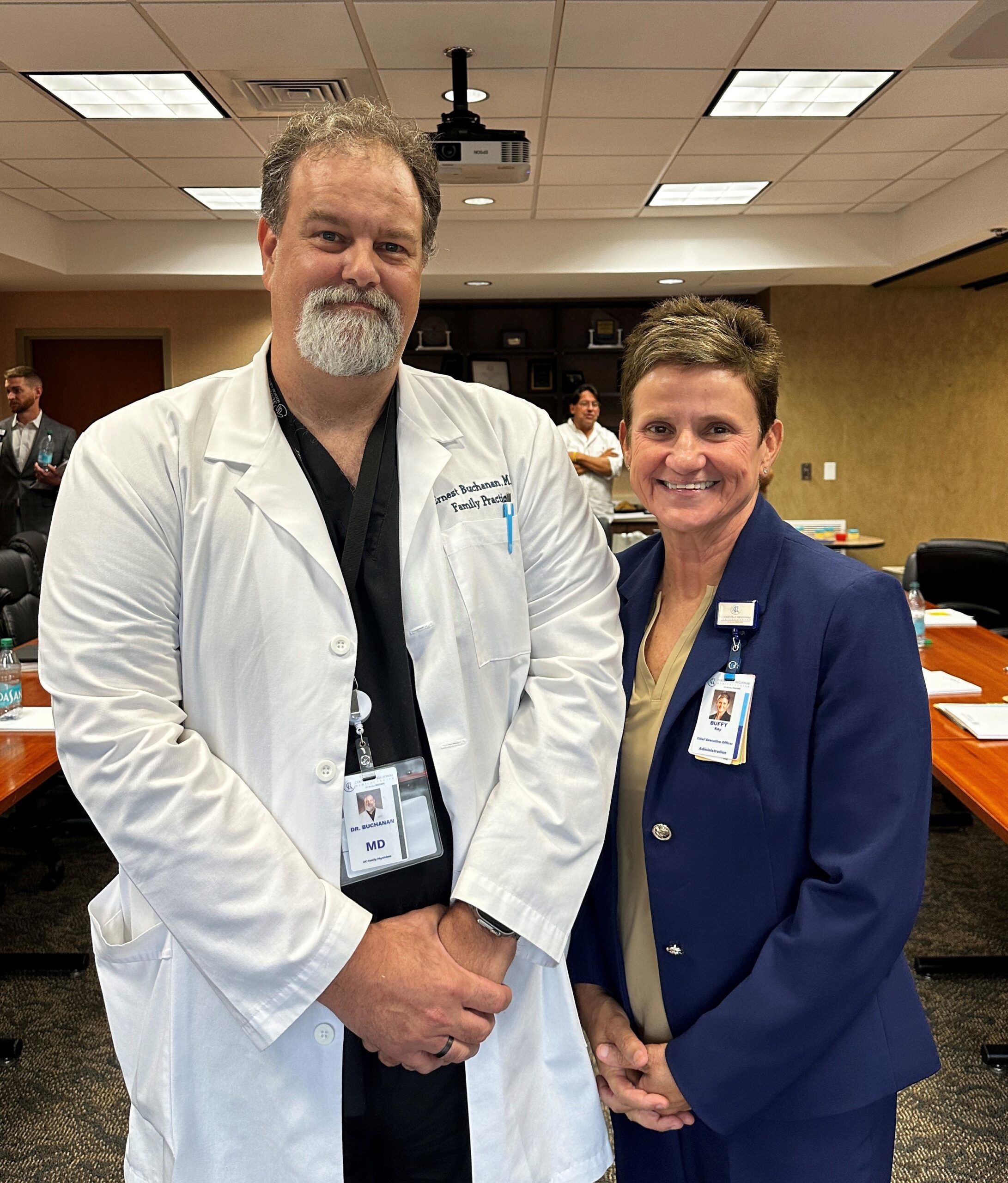 Dr. Ernest Buchanan poses with CEO Buffy Key as he is honored for his 9 years of service on the CRMC board.