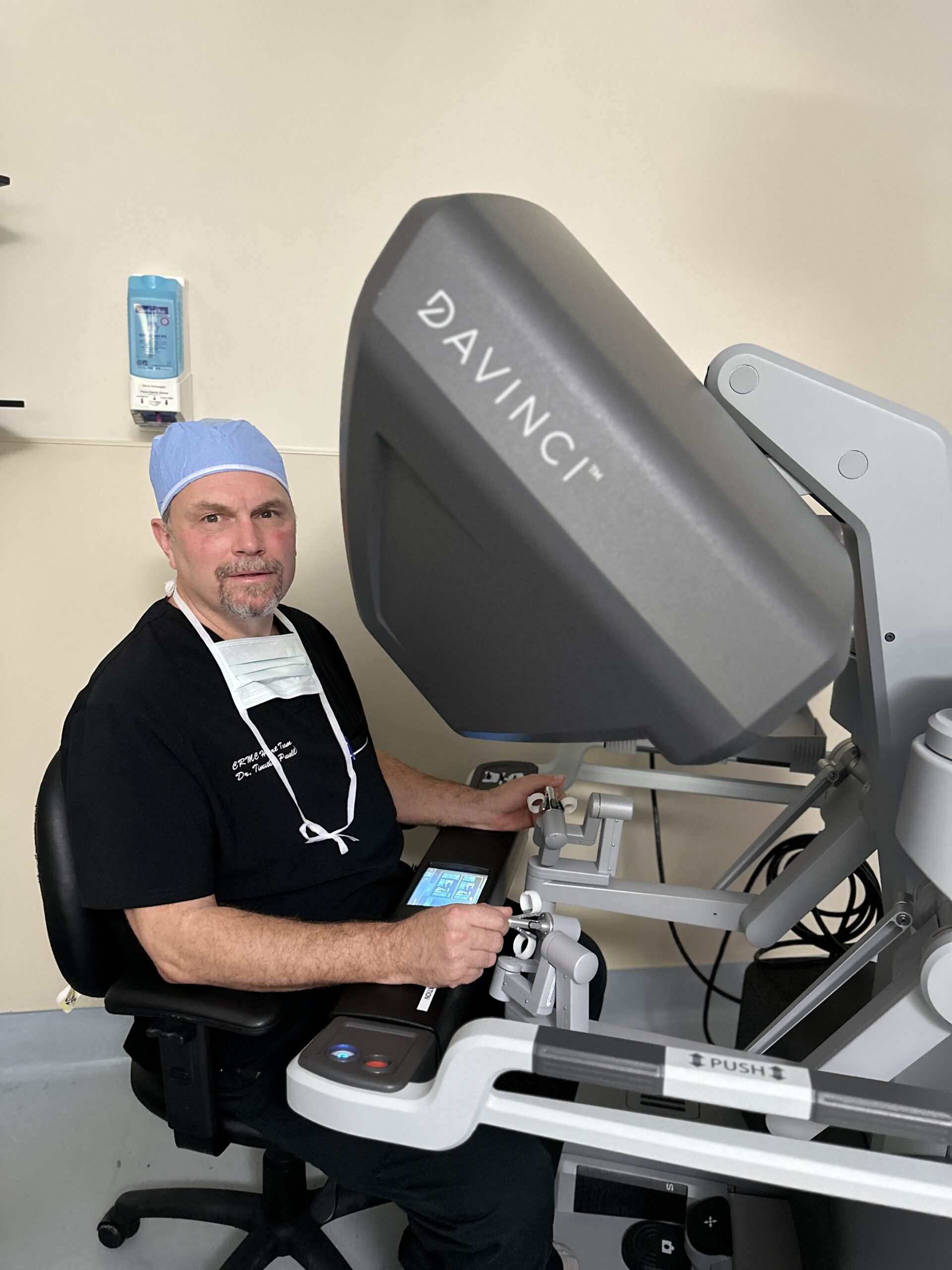 Dr. Powell on the da Vinci robotic surgical system prior to surgery.