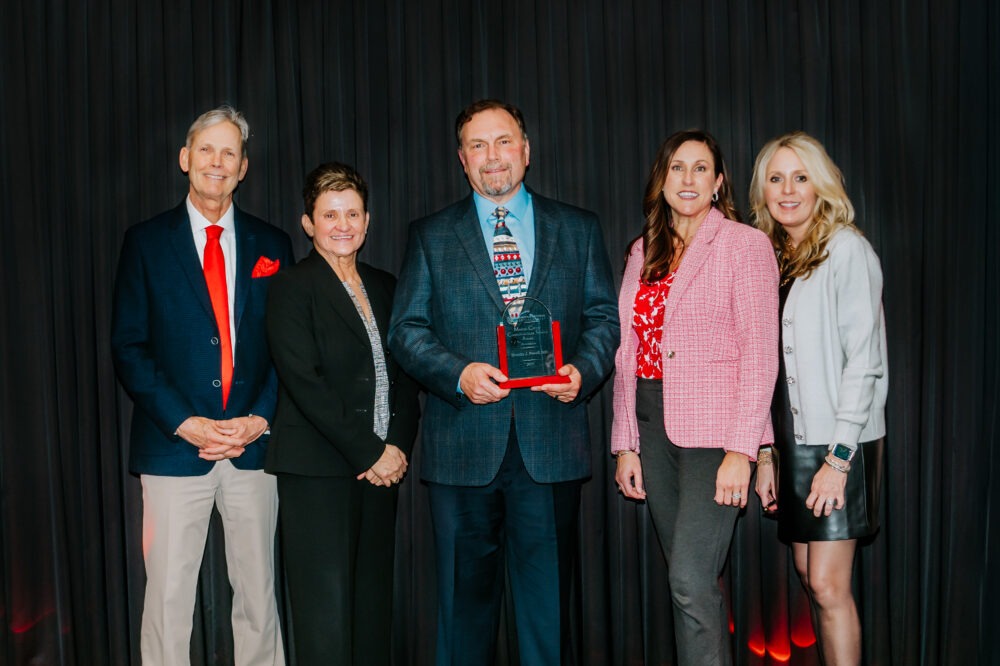 Dr. Timothy Powell accepts the 2025 Martin Coffey Award