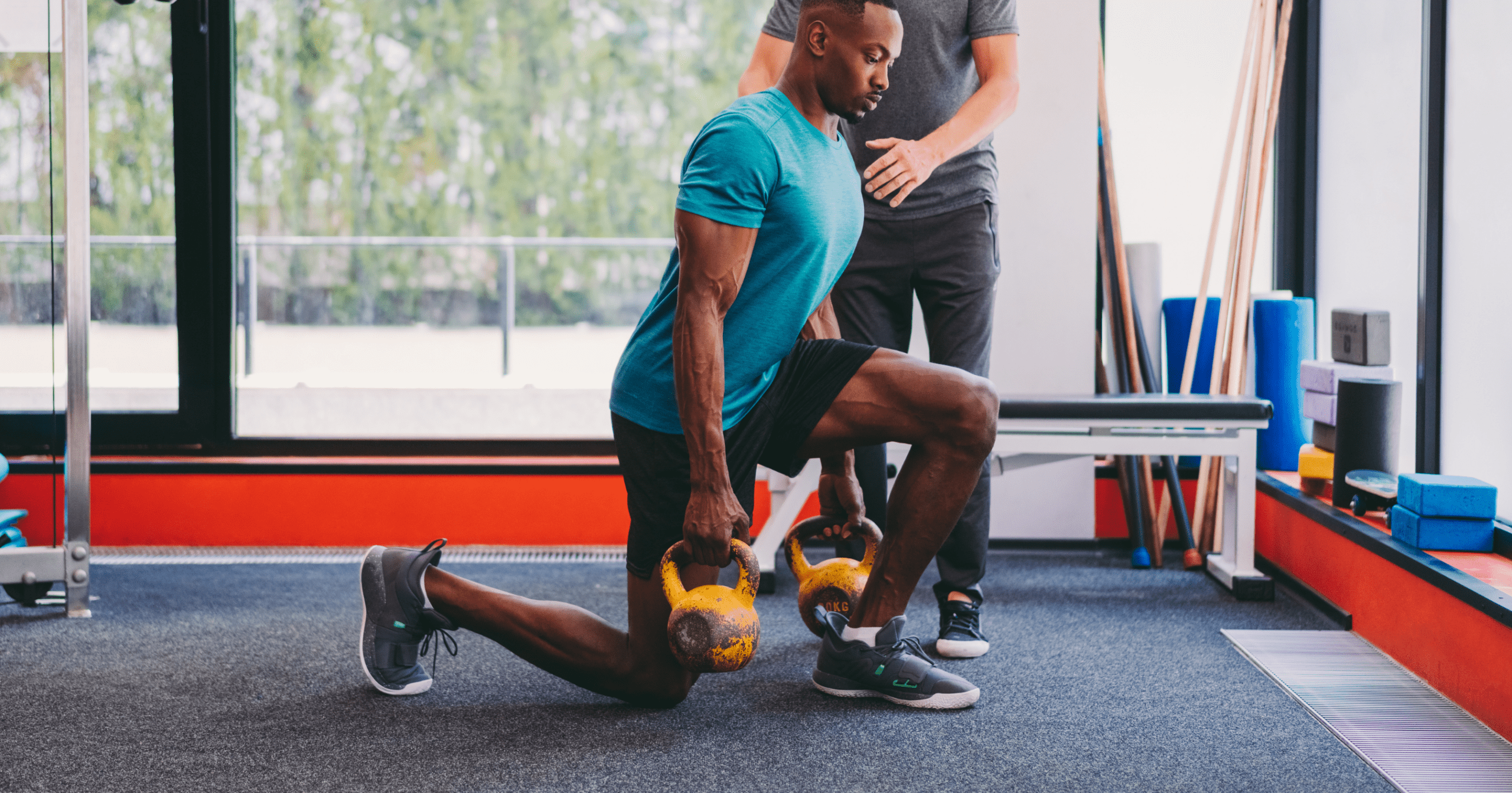 male patient working with athletic trainer